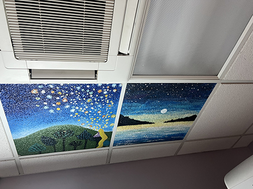 Beautiful ceiling tiles painted by students for the Betty Torricelli Institute for Breast Care