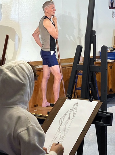 Figure model posing in art class