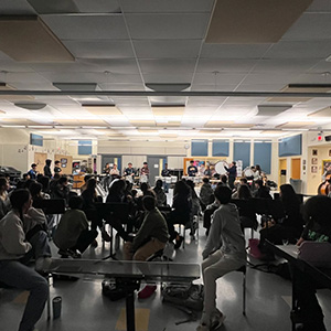 Students listening to band perform