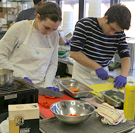 Students work in a kitchen